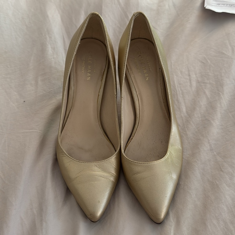 Cole Haan gold pumps